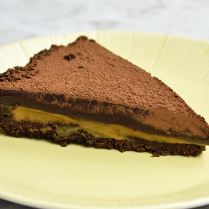 5 Ingredient Chocolate Caramel Tart on a yellow plate