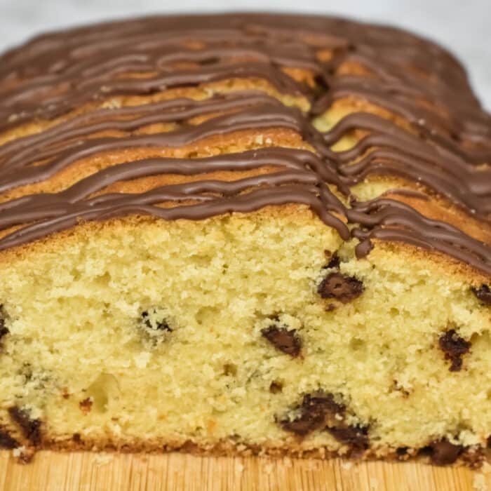 Chocolate chip cake on a wooden chopping board